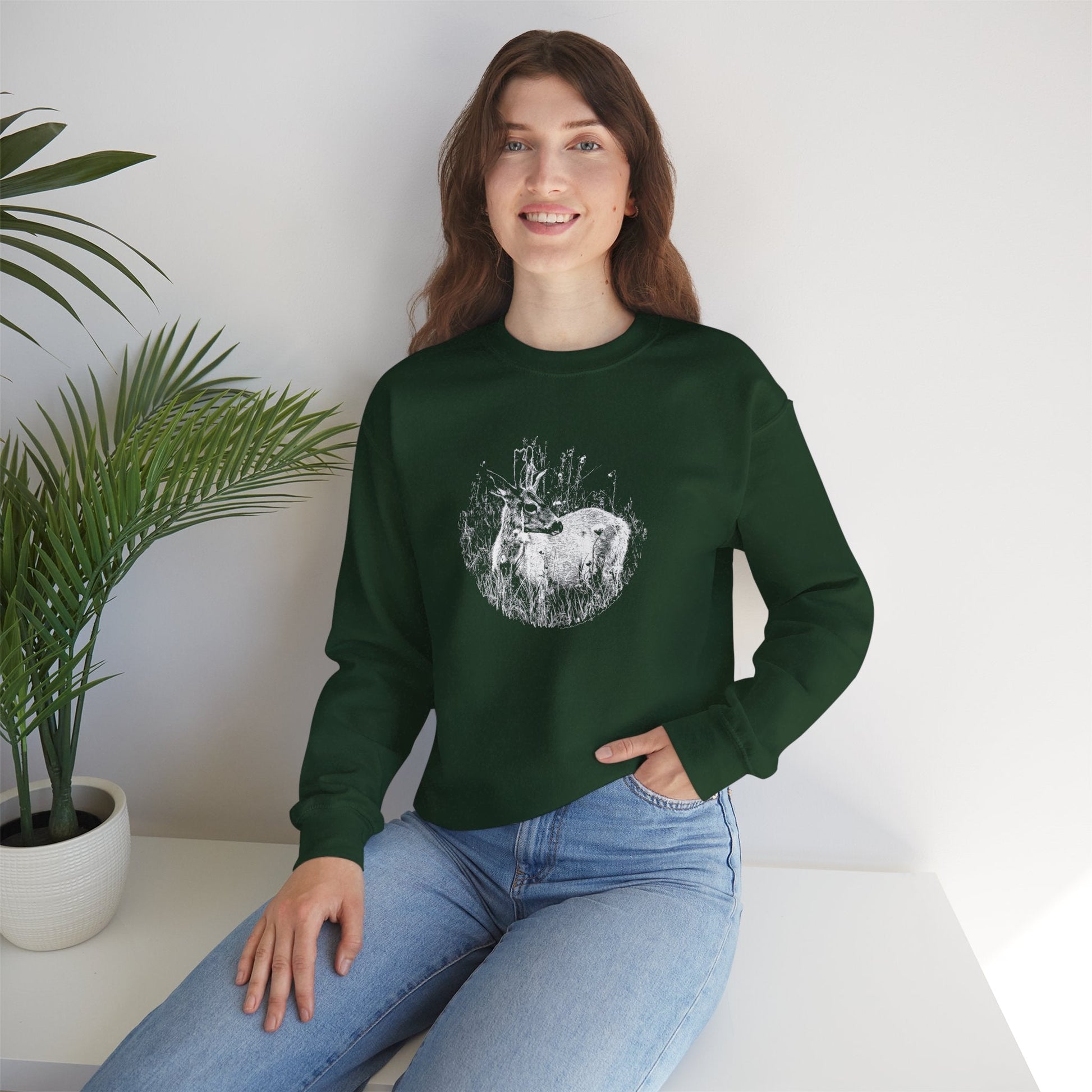 Model displaying fit on woman, 'Young Buck' sweater in 'forest green' colour.